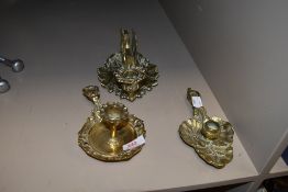 Three decorative vintage brass candle stick holders.