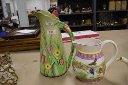 An Australian design Carlton ware jug having green ground with tulip and primrose pattern, also