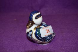 A Royal Crown Derby paperweight Sitting Duck with gold stopper