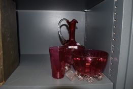 A cranberry glass decanter,beaker and footed bowl.