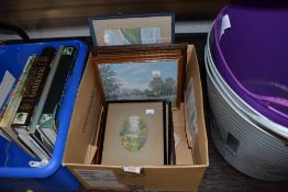 A box of pictures including watercolour, embroideries and more.
