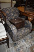 A nice quality early 20th Century low seat armchair having blue foliate upholstery