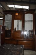 An Edwardian mahogany and inlaid two piece bedroom suite comprising mirror door wardrobe and