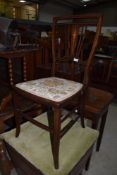 An Edwardian mahogany and inlaid bedroom chair