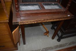 An early to mid 20th Century formica topped drawer leaf table
