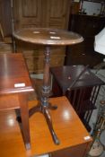 A traditional mahogany wine table on triple splay legs , diameter approx. 31cm