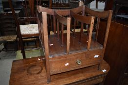 A 19th Century mahogany canterbury having drawer base