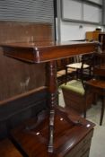 A 19th Century mahogany occasional pedestal table, top having frieze drawers to both ends, quadruple