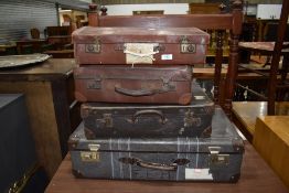 Four vintage cases, including leather