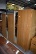 A pair of vintage golden oak mirror door wardrobes , early Stag