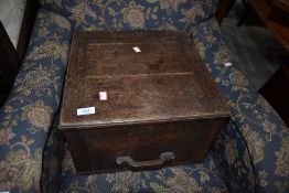 A vintage oak box having lift lid