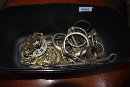 A collection of horse brasses , bit etc