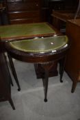 A reproduction half moon hall table, with skiver top, width approx. 76cm