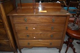 An early 20th Century mahogany bedroom chest of four long drawers having ledge back, width approx.