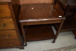 A vintage mahogany tea trolley