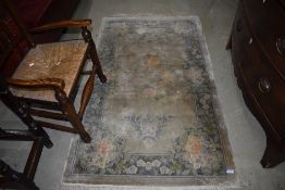 An oriental style silk fireside rug, approx. 156 x 92cm