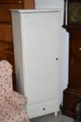 A modern white finished MDF wardrobe with lower shelf and drawer base, dimensions approx. W66cm