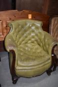 A period leather tub armchair on wood frame having button back and seat
