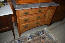 A Victorian washstand having three drawers and cupboard to lower section and matched slate top