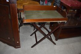 A traditional mahogany butlers tray and stand