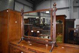 A traditional mahogany dressing table mirror, probably early 20th Century and a strung footstool