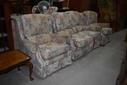 A traditional foliate three piece lounge suite, labelled G plan