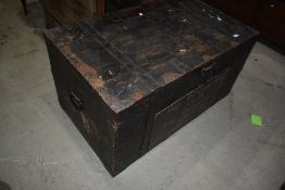 A late 19th/early 20th Century wooden travel trunk with cast clasps etc, with military connection