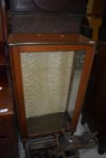 A mid 20th Century sapele display cabinet of stylised form on dansette style legs, width approx.