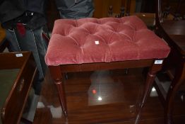 A modern pink dralon dressing table stool