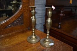 A pair of traditional brass candlesticks
