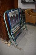 A vintage cast hospital or barrack style bed, approx. 107cm (3ft6) width, with sprung base