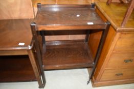 An early 20th Century dark stained oak tea trolley