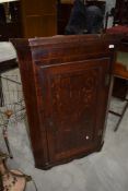 A period oak corner wall cabinet
