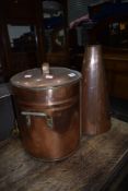 A traditional copper tea urn, stamped Kelly and Son, Edinburgh and a large copper funnel