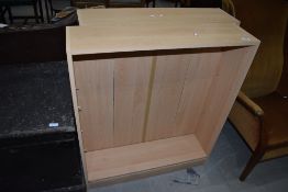A pair of laminate beech effect bookshelves