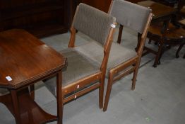 Two vintage upholstered dining chairs
