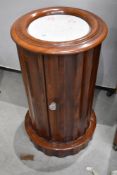 A 19th Century mahogany plant stand having marble inset top