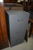 A laminate filing cabinet, three drawers, in gun metal grey, height approx. 103cm