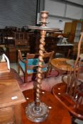 A 19th Century torchere having twist column and carved base, approx. height 92cm