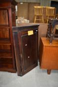 A period oak corner wall cupboard