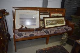 A traditional golden oak settle, having five panels to back and solid ends, width approx. 196cm