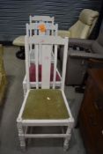 A set of three painted dining chairs, mixed seats