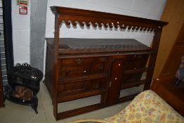 A period oak dresser having open back, width approx. 179cm