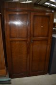 An early 20th Century oak wardrobe, width approx. 101cm