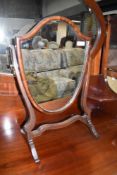 A traditional mahogany dressing table mirror, shield form, width approx. 37cm