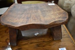 A rustic low footstool, stamped Wanderwood