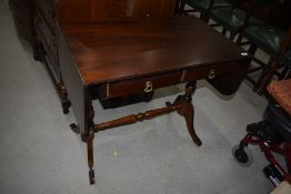 A reproduction Regency side/sofa table having drop flaps, closed with approx. 84cm, depth 51cm