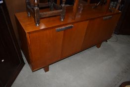 A vintage sapele or teak office sideboard having chromed handles, labelled for Port Eglinton, Andrew