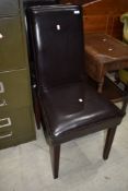 A pair of leatherette dining chairs