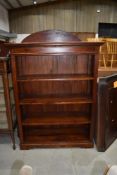 A reproduction mahogany bookshelf, labelled Ancient Mariner, width approx.108cm